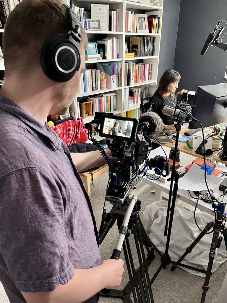 Photo of Monica Guzman podcasting