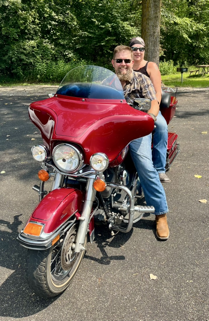 Wilk and Monica Wilkinson on a motorcycle